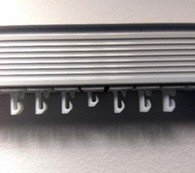 pegs pushed into vertical blind headrail